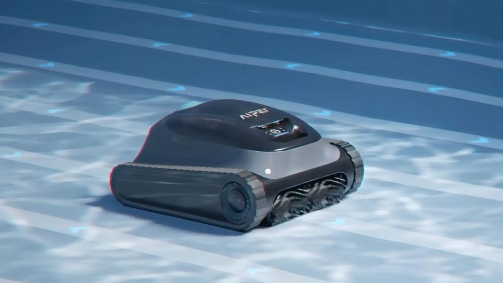 A robotic pool cleaner scrubbing the pool floor to remove dead algae and fine debris after shocking the water.