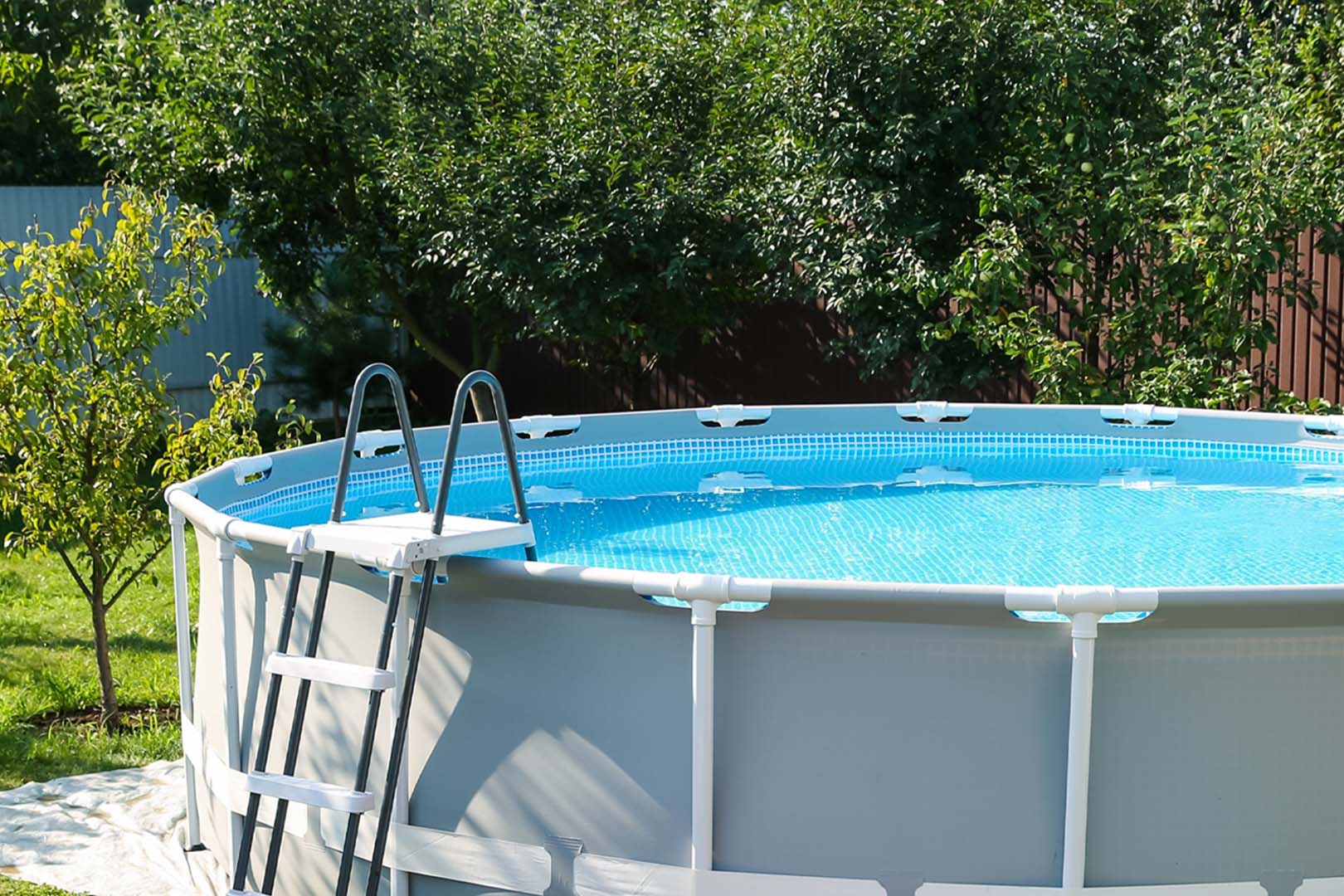 a outdoor pool surrounded by trees