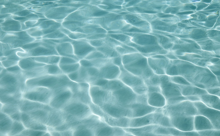 Clear blue swimming pool water surface