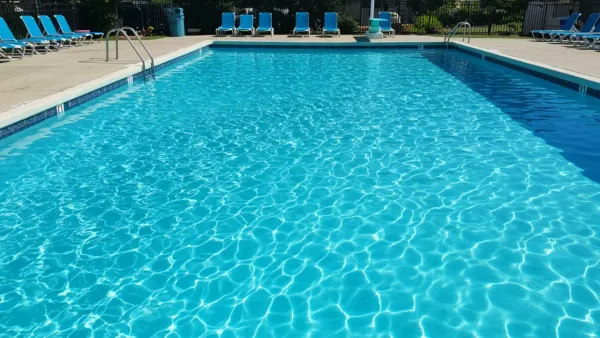A crystal-clear, sparkling blue pool on a sunny day, representing perfectly balanced water chemistry.