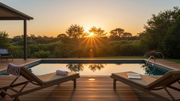 A pristine, hose-free pool deck at sunset, highlighting the convenience and clutter-free experience of using battery pool cleaners.