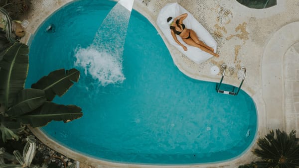 large backyard swimming pool showing scale for robotic cleaner use